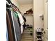 Organized walk-in closet with shelves, clothing racks, and shoe storage at 335 Lansbrook Ln, Winter Springs, FL 32708