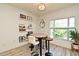 Dining area with high-top table, modern seating, stylish wall art, and a bright window overlooking the scenic outdoor view at 335 Lansbrook Ln, Winter Springs, FL 32708