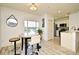 Intimate dining space with a high-top table, modern chairs, and a clear view into the well-appointed kitchen at 335 Lansbrook Ln, Winter Springs, FL 32708