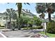 Beautiful yellow townhome with white trim, lush landscaping, and a private entrance for each unit at 335 Lansbrook Ln, Winter Springs, FL 32708