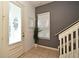 Bright foyer with decorative glass front door, tiled floor, and staircase leading to the upper level at 335 Lansbrook Ln, Winter Springs, FL 32708