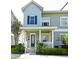 Charming two-story home featuring a covered porch with white columns and beautifully landscaped front yard at 335 Lansbrook Ln, Winter Springs, FL 32708