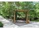 Community gazebo with bench seating and lush landscaping at 335 Lansbrook Ln, Winter Springs, FL 32708