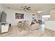 Comfortable living room with neutral-toned sofa, decorative pillows, and stylish decor, including an artistic lion portrait at 335 Lansbrook Ln, Winter Springs, FL 32708