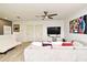 Spacious living area with comfortable seating, modern TV, stylish decor, and wood-style flooring at 335 Lansbrook Ln, Winter Springs, FL 32708