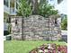 Community signage for Jesup's Reserve with flowers at 335 Lansbrook Ln, Winter Springs, FL 32708