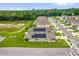 Overhead view of homes with solar panels surrounded by green landscape at 336 Pelham Park Dr, Deland, FL 32720