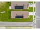 Aerial view featuring houses with solar panels in a lovely neighborhood at 336 Pelham Park Dr, Deland, FL 32720