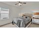 Cozy bedroom features a ceiling fan, natural light, and calm decor at 336 Pelham Park Dr, Deland, FL 32720