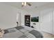 Comfortable bedroom with ceiling fan, neutral tones, and a view into the hallway at 336 Pelham Park Dr, Deland, FL 32720