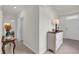 Bright entryway featuring neutral walls, ceramic tile and a decorative table at 336 Pelham Park Dr, Deland, FL 32720