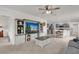 Spacious living room featuring a large entertainment center and an open layout to the dining area and kitchen at 336 Pelham Park Dr, Deland, FL 32720