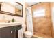 Bathroom featuring a shower with tile, a vanity with a mirror, and a toilet at 3410 Calumet Dr, Orlando, FL 32810