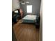 Bedroom with hardwood floors, a ceiling fan, and a window for natural light at 3410 Calumet Dr, Orlando, FL 32810