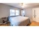 Cozy bedroom featuring a comfortable bed, natural lighting, and convenient access to other areas of the home at 3410 Calumet Dr, Orlando, FL 32810