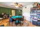 Spacious game room with a round poker table and shelving for games and storage at 3410 Calumet Dr, Orlando, FL 32810