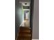 Hallway features fresh gray paint, natural colored hardwood floors, and recessed lighting at 3410 Calumet Dr, Orlando, FL 32810