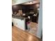 Modern kitchen with dark cabinets, stainless steel appliances, and a mosaic tile backsplash at 3410 Calumet Dr, Orlando, FL 32810