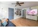 Inviting living room with wood floors, modern lighting, entertainment center, and ample space for furnishings at 3410 Calumet Dr, Orlando, FL 32810