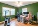 Spacious home office with green walls, natural light, modern decor, and ample space for productivity at 3410 Calumet Dr, Orlando, FL 32810