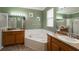 Large bathroom with double sinks, garden tub, and separate shower at 3562 Foxchase Dr, Clermont, FL 34711