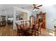 Cozy dining room with wood floors, traditional furnishings, and plenty of natural light at 3562 Foxchase Dr, Clermont, FL 34711