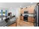 Modern kitchen boasts granite countertops, stainless steel appliances, and ample cabinet space at 3562 Foxchase Dr, Clermont, FL 34711