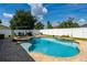 Sparkling pool and spa combo with an outdoor dining area and plenty of room for relaxation at 3562 Foxchase Dr, Clermont, FL 34711