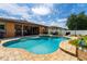 Backyard with a screened-in lanai and heated pool and spa combo perfect for relaxation at 3562 Foxchase Dr, Clermont, FL 34711