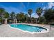 Community pool with seating and pergola at 3562 Foxchase Dr, Clermont, FL 34711