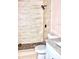 Modern bathroom featuring tiled shower with a rainfall shower head and neutral color palette at 425 Walnut St, Daytona Beach, FL 32114