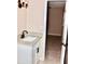 Modern bathroom features a granite vanity and a door to a walk-in closet at 425 Walnut St, Daytona Beach, FL 32114
