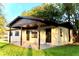 Exterior view of home with covered entry and well maintained lawn at 425 Walnut St, Daytona Beach, FL 32114
