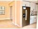 Well-lit kitchen, stainless steel appliances, and a doorway to the adjacent bathroom at 425 Walnut St, Daytona Beach, FL 32114