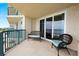 Relax on this balcony with comfortable seating and enjoy the ocean view from sliding glass doors at 4621 S Atlantic Ave # 7202, Port Orange, FL 32127