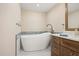 Bright bathroom featuring soaking tub and stylish vanity at 4621 S Atlantic Ave # 7202, Port Orange, FL 32127