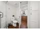 Modern bathroom featuring a toilet, shower, and entrance to kitchen at 4621 S Atlantic Ave # 7202, Port Orange, FL 32127