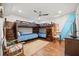 Beach themed ' room with 2 bunk beds, tile floors, and ceiling fan at 4621 S Atlantic Ave # 7202, Port Orange, FL 32127