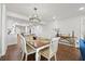 Dining room features a table with seating for six and chandelier at 4621 S Atlantic Ave # 7202, Port Orange, FL 32127