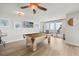 Billiards room features a light wood pool table, ceiling fan, and TV at 4621 S Atlantic Ave # 7202, Port Orange, FL 32127