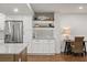 Charming kitchen area with coastal decor, stainless steel refrigerator, and a cozy built-in desk space at 4621 S Atlantic Ave # 7202, Port Orange, FL 32127