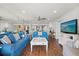 Living room with open floor plan and ocean view from sliding glass doors to balcony at 4621 S Atlantic Ave # 7202, Port Orange, FL 32127