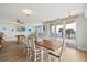 Spacious living area with a pool table and comfortable seating, offering stunning ocean views through large windows at 4621 S Atlantic Ave # 7202, Port Orange, FL 32127