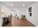 Open living space with wood-look floors, a desk and comfortable seating at 4621 S Atlantic Ave # 7202, Port Orange, FL 32127