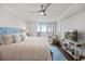 Bright main bedroom with balcony access offering beautiful ocean views at 4621 S Atlantic Ave # 7202, Port Orange, FL 32127
