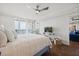 Comfortable main bedroom featuring a ceiling fan, large windows with ocean view at 4621 S Atlantic Ave # 7202, Port Orange, FL 32127
