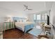 Spacious main bedroom with a king-size bed, balcony access and ocean view at 4621 S Atlantic Ave # 7202, Port Orange, FL 32127