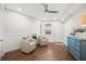 Inviting sitting area with wood-look floors, comfortable seating, and stylish decor at 4621 S Atlantic Ave # 7202, Port Orange, FL 32127