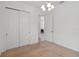 Bright bedroom featuring carpeting, a ceiling fan and a pair of double door closets at 4759 Riverwalk Dr, St Cloud, FL 34771