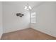Neutral bedroom with a decorative accent wall hanging and carpeted floors at 4759 Riverwalk Dr, St Cloud, FL 34771
